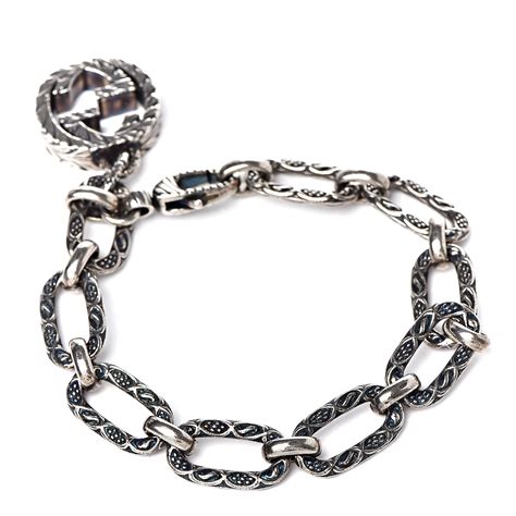 gucci sterling silver trademark charm bracelet|Gucci silver interlocking charm bracelet.